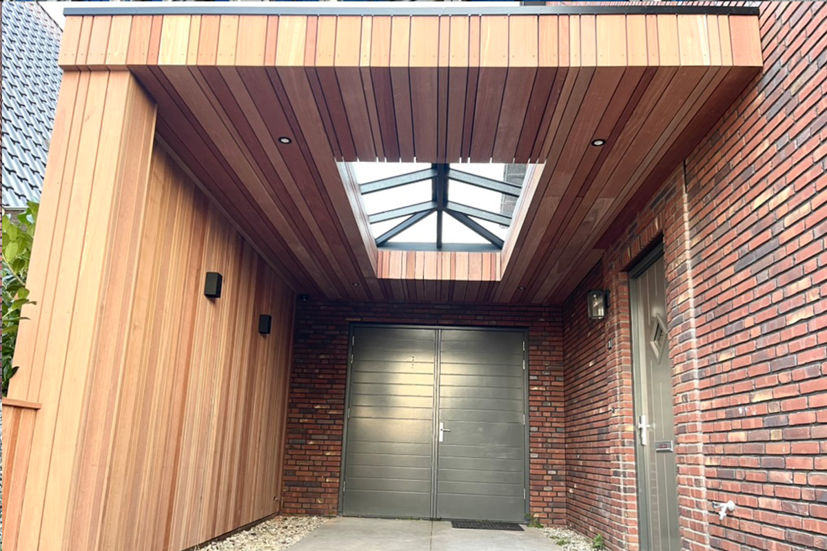 Covered entrance project featuring custom wooden cladding, glass skylight, and integrated lighting design